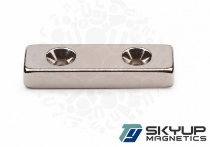 Block magnets with counter sunk holes used in Electronics.motors ,generators.produced by professional magnets factory